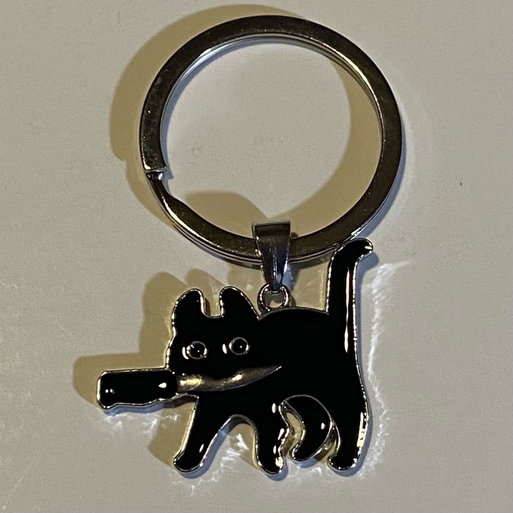 Stabby Kitty keychain in chrome plate/black enamel NWOT 2” long, Kitty gone bad!